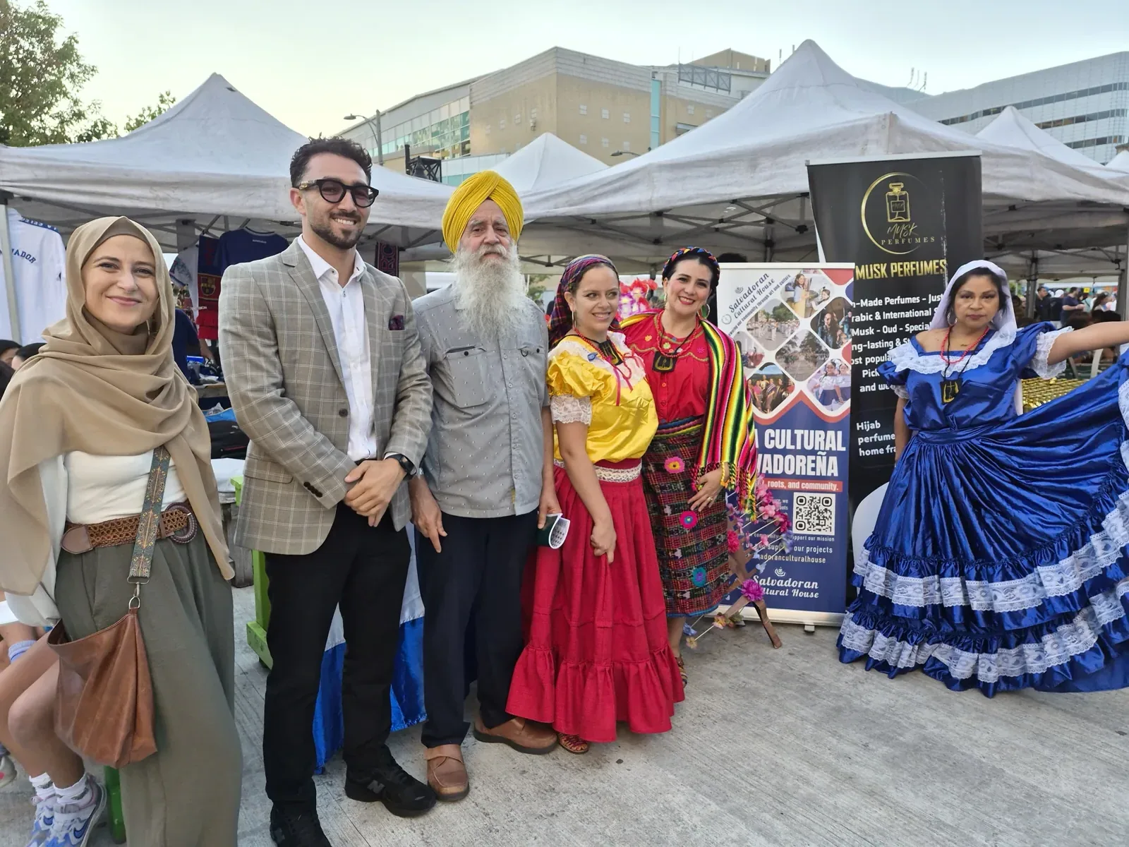 Gurinder Pal Singh with festival guests and cultural dancers at the African-Caribbean Mosaic Cultural Festival
